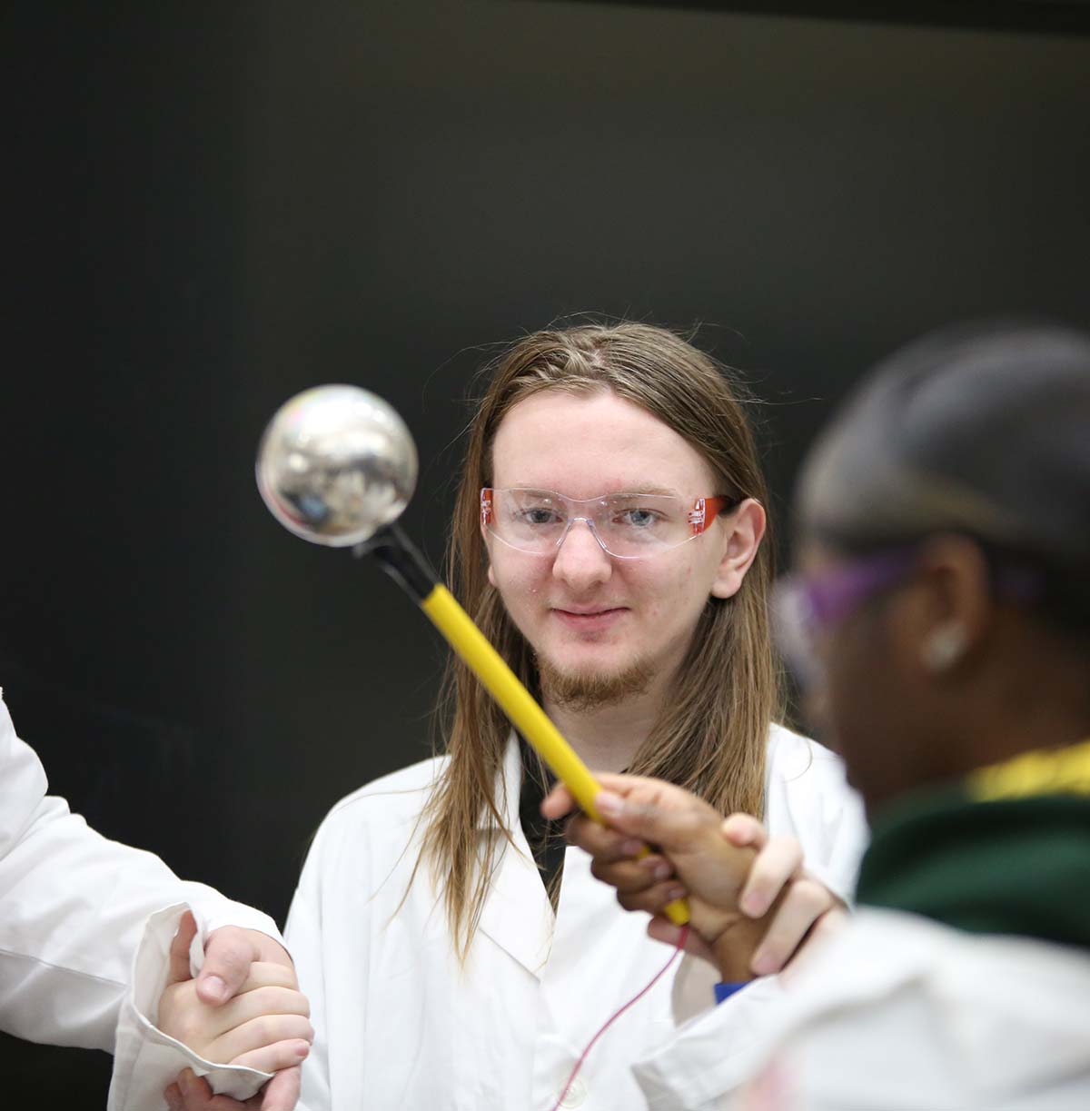 Student drawing in a classroom.