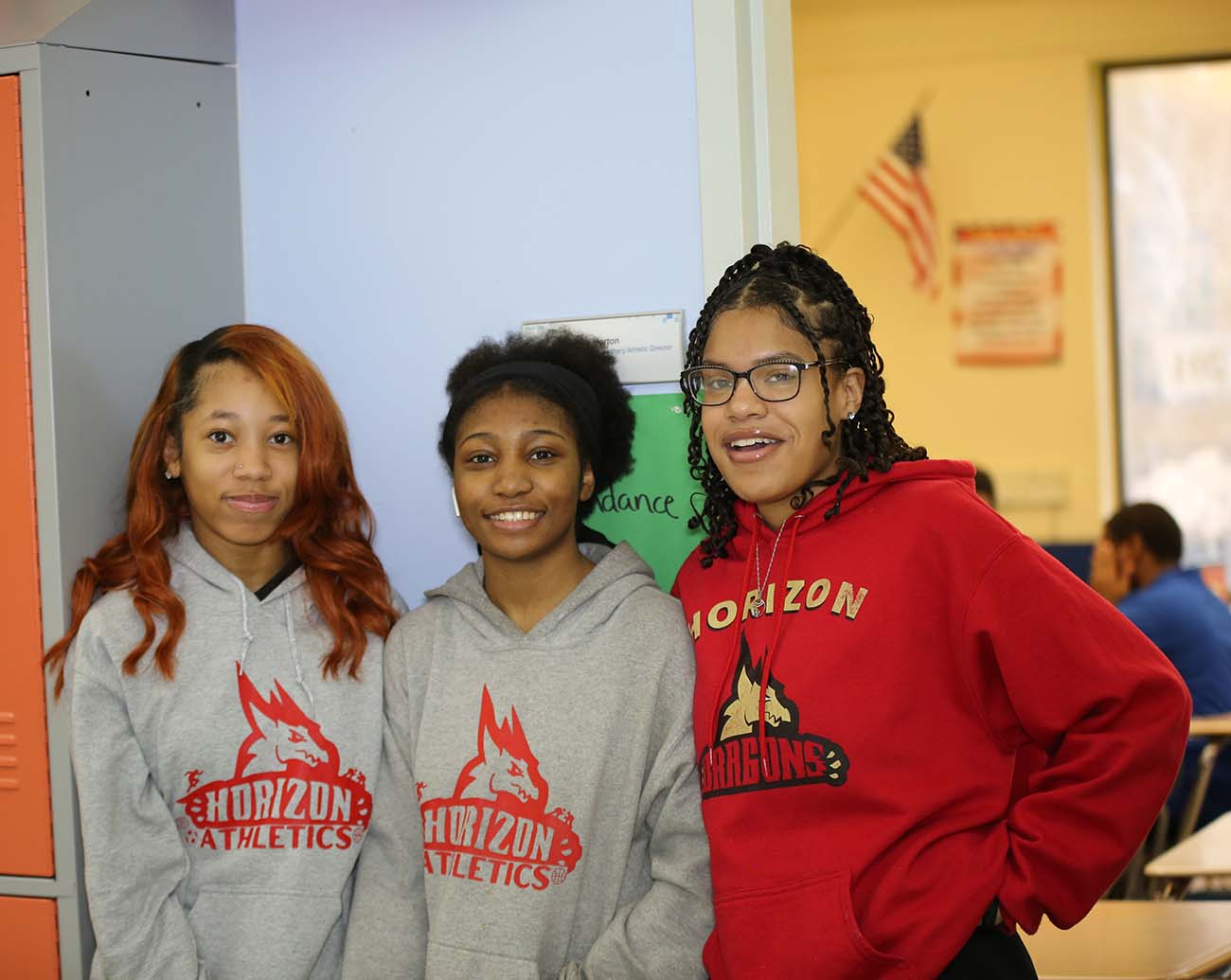 Teacher or school staff member warmly interacting with a student outside